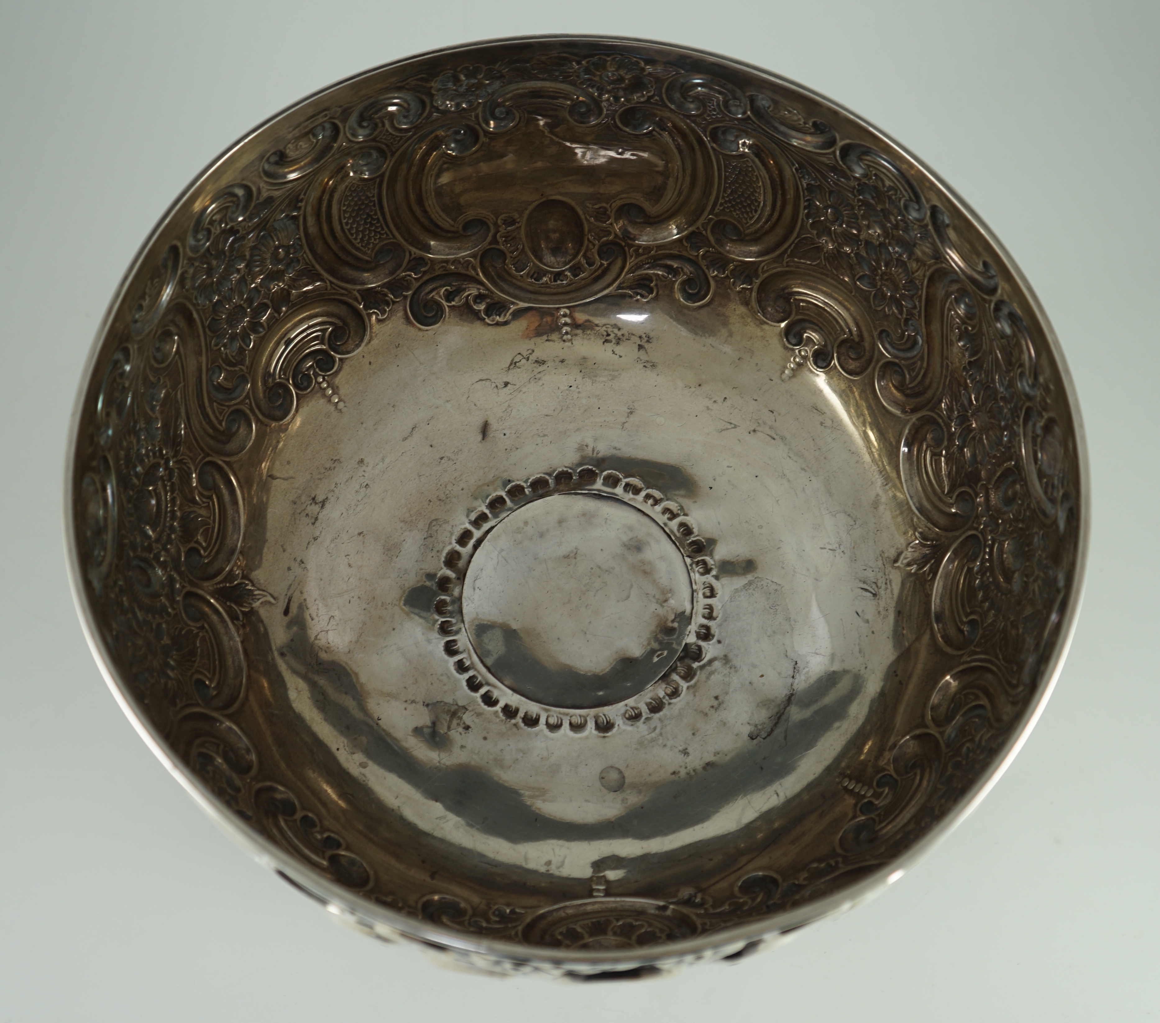 A late Victorian embossed silver pedestal punch bowl by Mappin Brothers (a.f.)